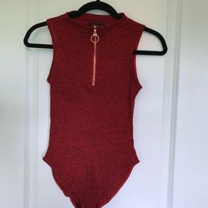 Material Girl red/ black multicolored ribbed leotard.